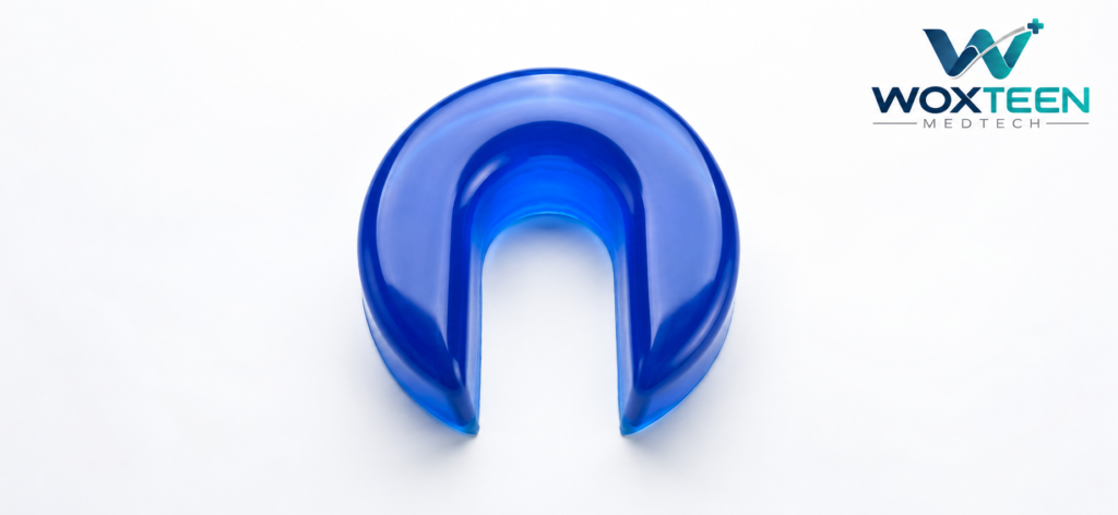 U-shaped silicone gel pillow with contoured head support design and central opening for hair transplant procedures.